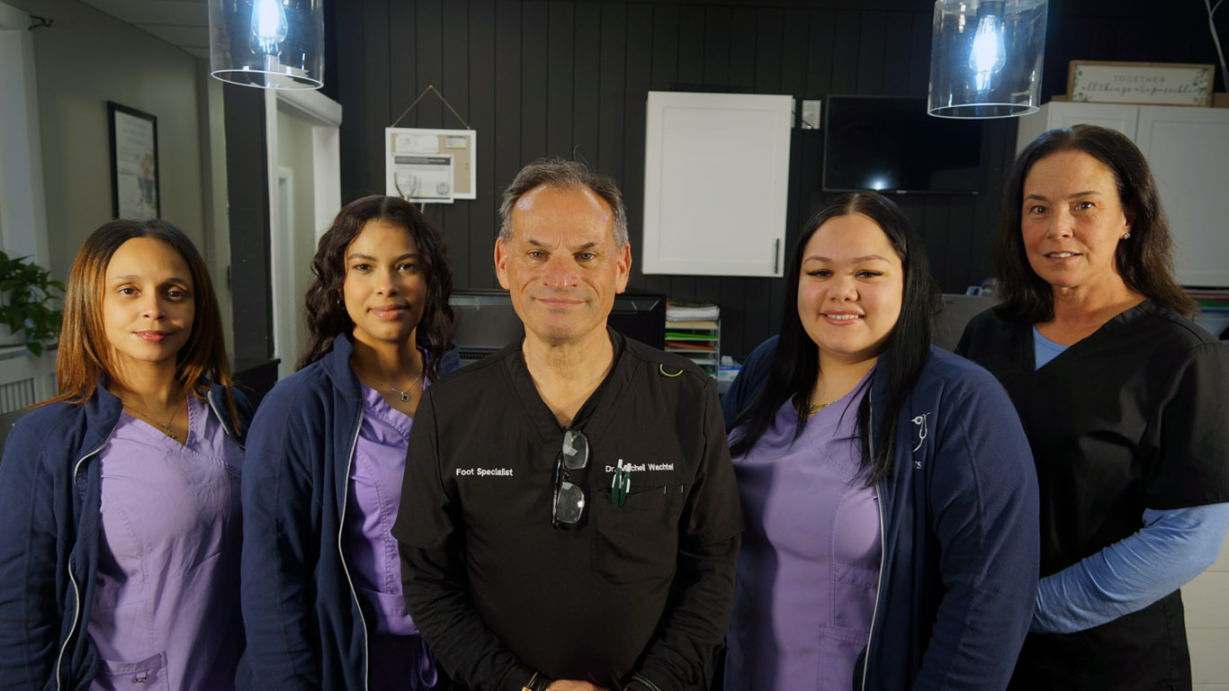 A group photo of some of the team members and podiatry specialists at Mitchell Wachtel, DPM.